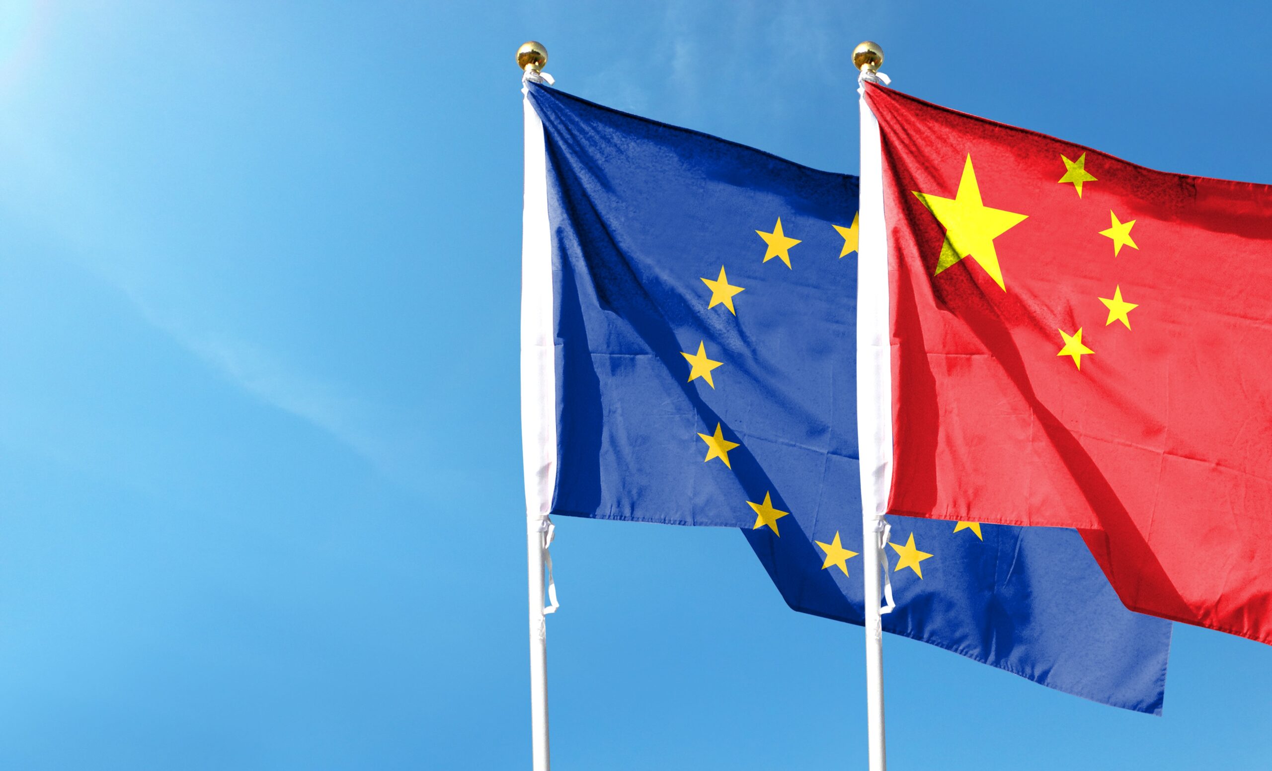 china,flag,and,eu,flag,on,cloudy,sky.,waving,in