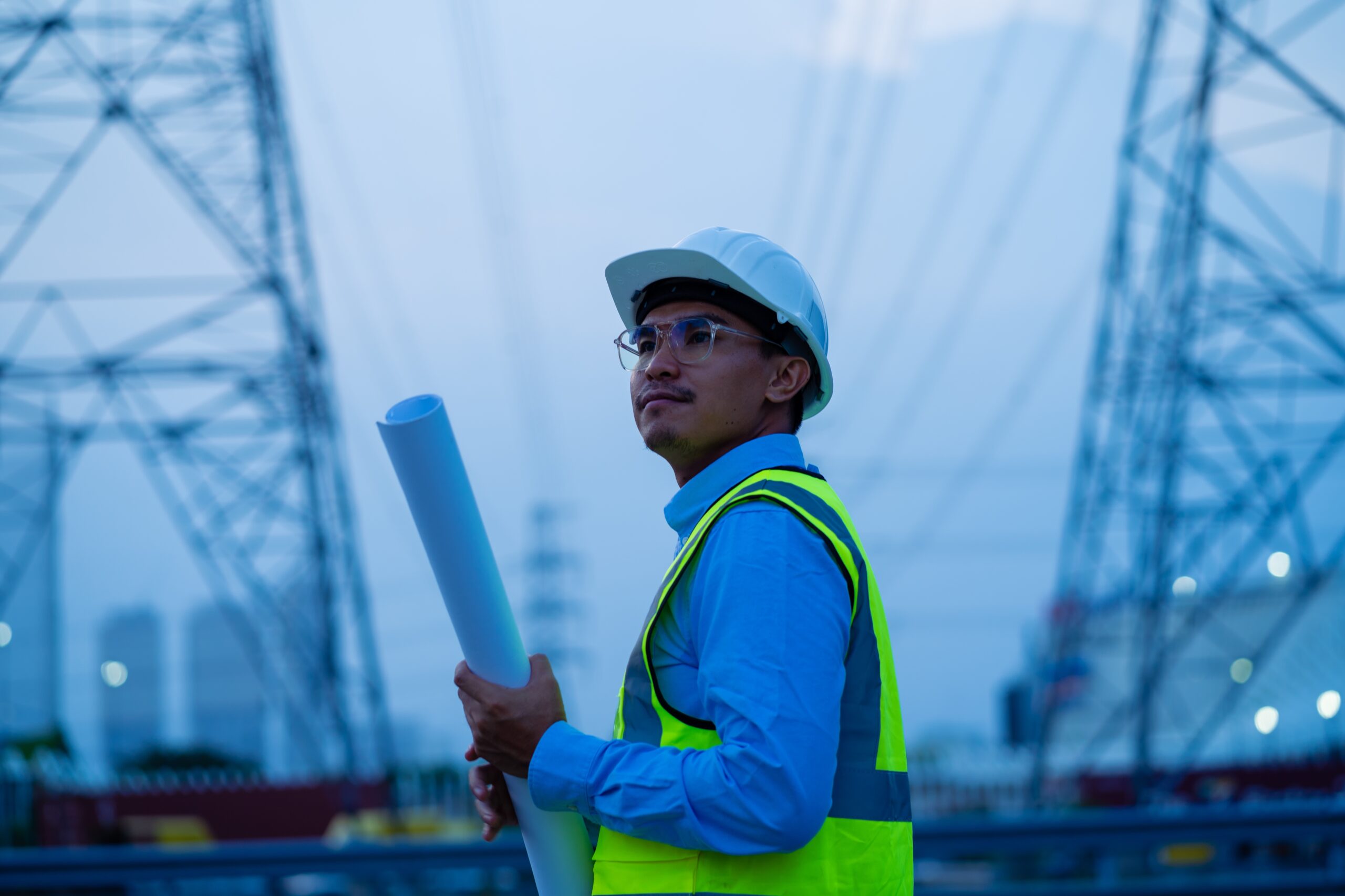 a,man,wearing,a,yellow,vest,and,a,hard,hat